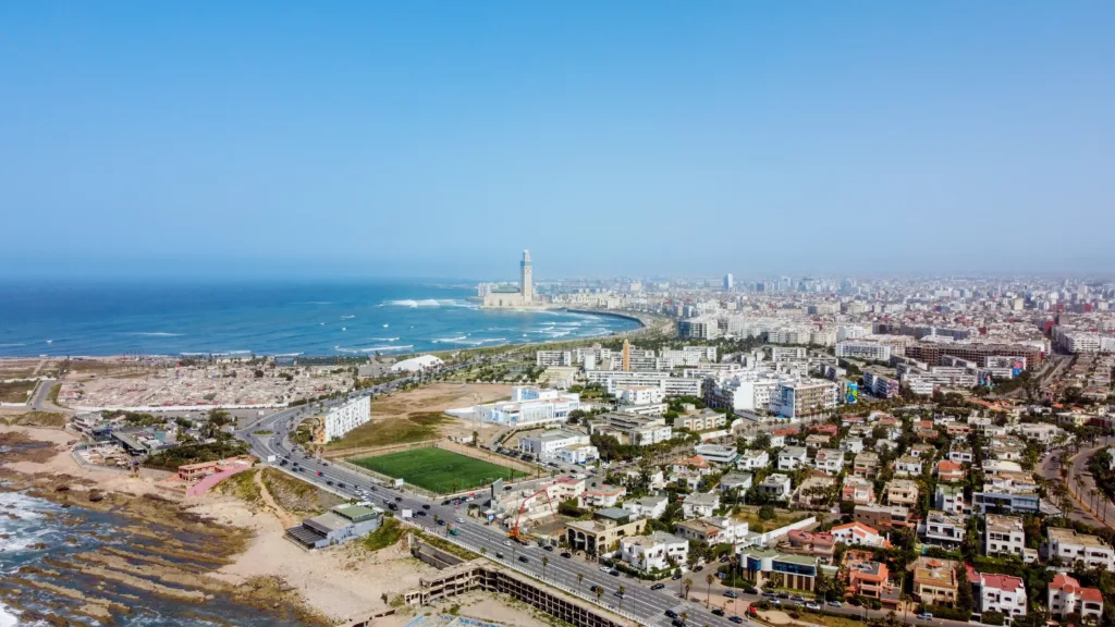 aerial drone view casablanca morocco atlantic ocean rocky coastline with residential buildings